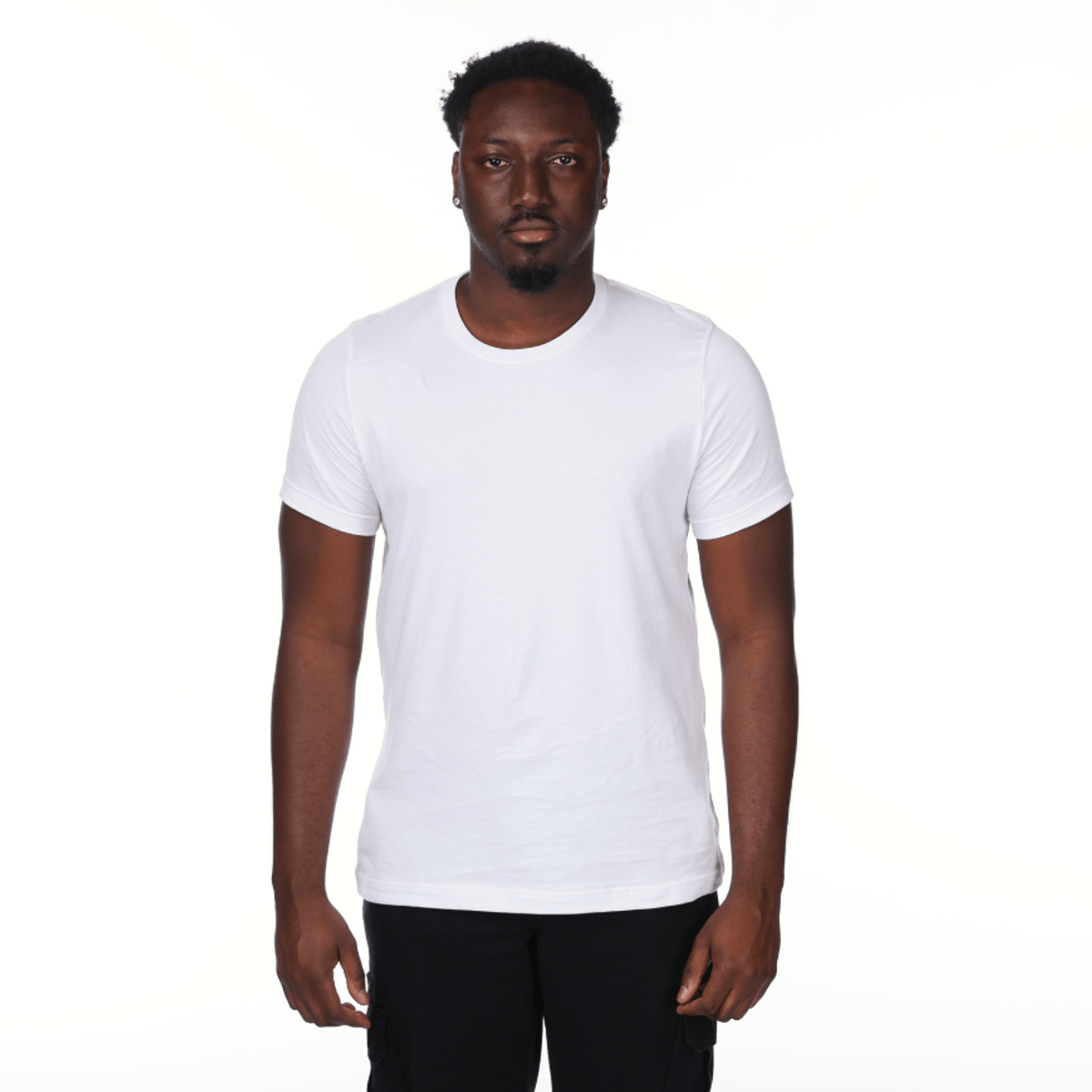 Man wearing a plain white t-shirt on a white background